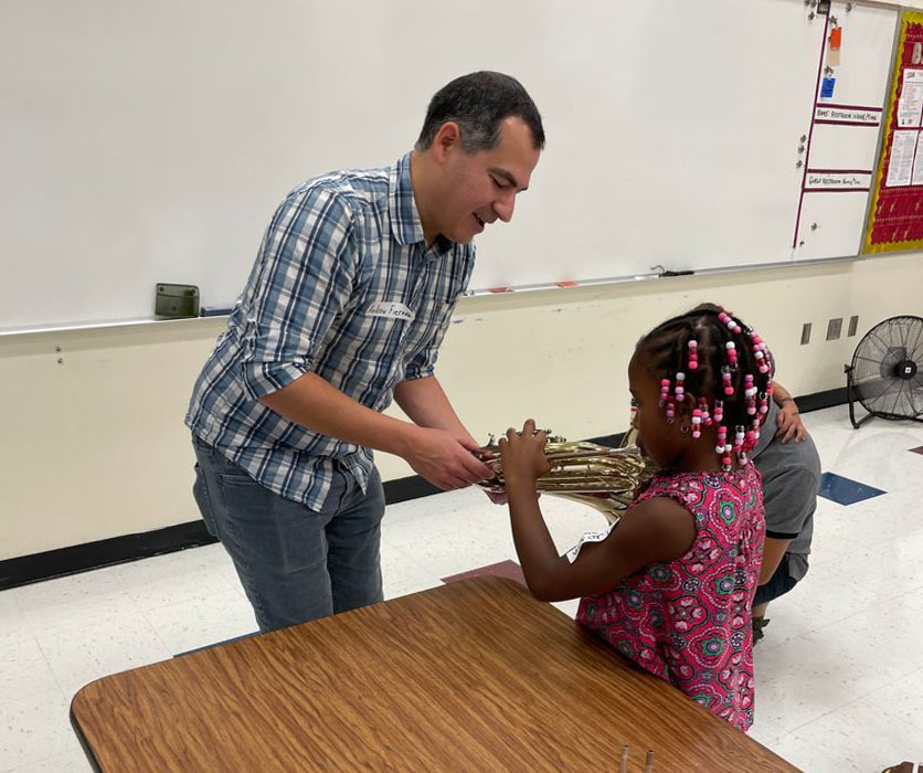 Mr. Fierova working with a young horn player